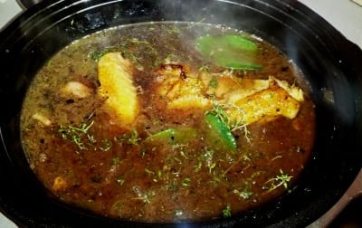 crock pot with coq au vin cooking