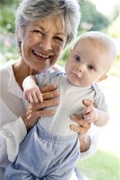 Grandmother with baby in garden