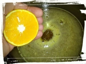 Simmering orange juice in pot