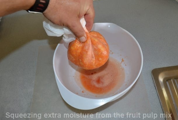 using muslin to help remove extra moisture from fruit pulp