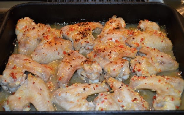 Thai lemongrass and ginger chilli chicken wings on baking tray