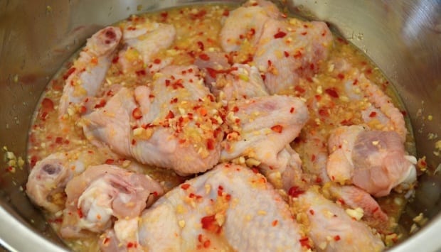 chicken wings marinating in lime lemongrass chilli ginger garlic mix